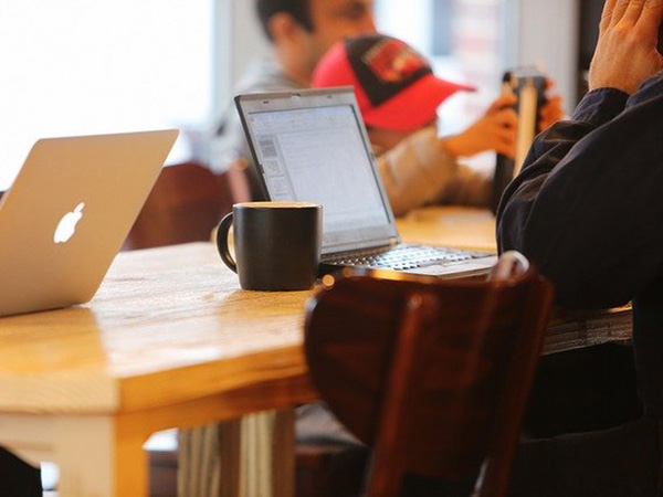 person reading blogs on laptop