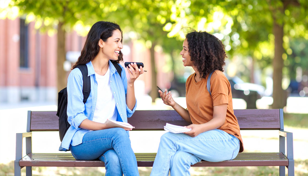 photo of student interviewing faculty member